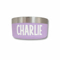 Purple pet bowl with 'CHARLIE' printed on it against a white background
