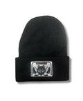 Black beanie with a wolf patch on a white background